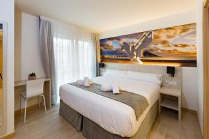Postel nebo postele na pokoji v ubytování Atotxa Rooms