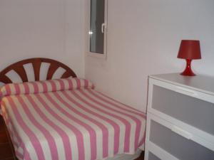 Un ou plusieurs lits dans un hébergement de l'établissement Cullera's Villa