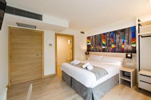 Postel nebo postele na pokoji v ubytování Atotxa Rooms