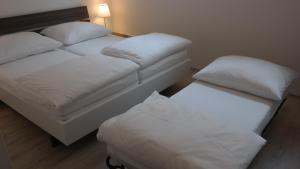 Posteľ alebo postele v izbe v ubytovaní Antonio Appartement