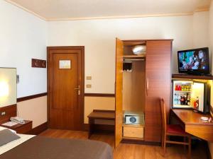 TV a/nebo společenská místnost v ubytování Hotel Signa