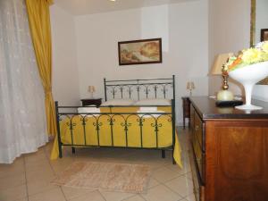 En eller flere senger på et rom på Tenuta Santa Giovanna