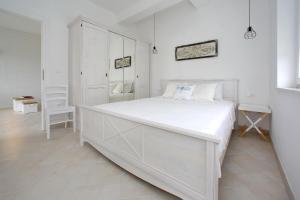 Tempat tidur dalam kamar di Villa Maris