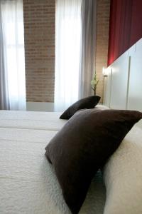 Postel nebo postele na pokoji v ubytování Hotel La Bastida