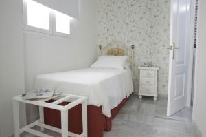 Cama o camas de una habitación en Basic Hotel Puerta de Sevilla