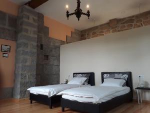 A bed or beds in a room at Quinta de Águia - Non-Smoking Property