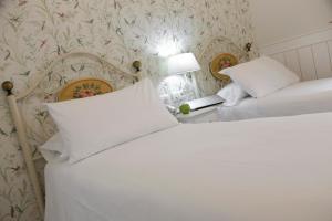 Cama o camas de una habitación en Basic Hotel Puerta de Sevilla