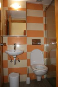Koupelna v ubytování Metaxa Hotel