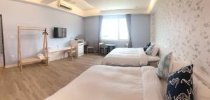 Krevet ili kreveti u jedinici u okviru objekta Pisces Garden B&B