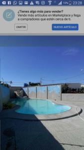 a screenshot of a text message about a swimming pool at Casa Amueblada en Salinas in Salinas