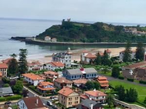 an aerial view of a town next to a beach at La Barquera in Ribadesella