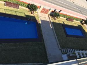 an overhead view of a swimming pool on a lawn at Super Luxury Penthouse in Jávea