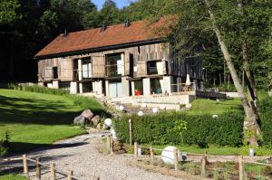 a large wooden house on top of a hill at Klekotki Spa & Resort in Klekotki