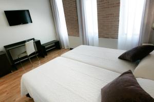 Postel nebo postele na pokoji v ubytování Hotel La Bastida