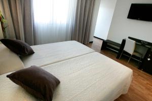 Postel nebo postele na pokoji v ubytování Hotel La Bastida