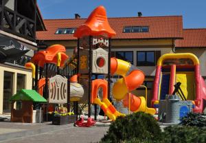 a playground in front of a building at Arena Slonca in Łeba