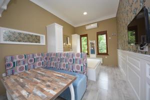 a living room with a couch and a table and a tub at Best of Bascarsija apartments in Sarajevo