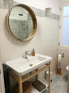 a bathroom with a sink and a mirror at Tirwal Suite in Teruel +27 photos