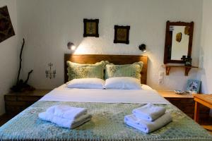 Кровать или кровати в номере Spiros Rooms