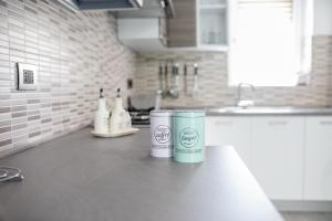 two canisters sitting on a counter in a kitchen at Casa Angela Rosa in Carovigno +46 photos