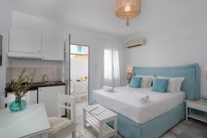 Posteľ alebo postele v izbe v ubytovaní Ippokampos Town Apartments