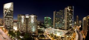 a city skyline at night with tall buildings at Grand Hyatt Atlanta in Buckhead in Atlanta