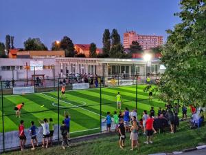 a group of people standing on a soccer field at Complex Marea Neagra in Eforie Nord +33 photos