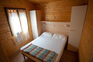 Säng eller sängar i ett rum på Camping Viareggio