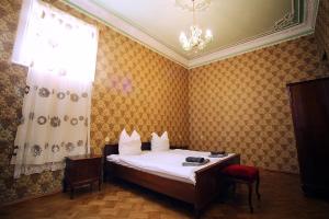 Postel nebo postele na pokoji v ubytování Guest House Old Kutaisi