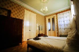 Postel nebo postele na pokoji v ubytování Guest House Old Kutaisi