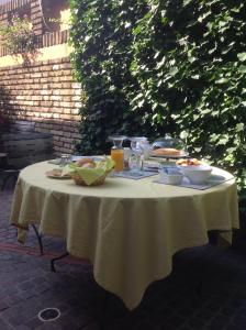 a table with food and drinks on top of it at Casa Poli in Ravenna