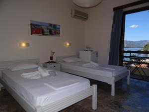 Ένα ή περισσότερα κρεβάτια σε δωμάτιο στο Villa Irene