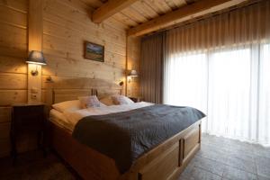 Postel nebo postele na pokoji v ubytování Rezidence u Jezera