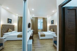 Ένα ή περισσότερα κρεβάτια σε δωμάτιο στο L'image Art Hotel