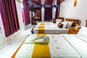 Postel nebo postele na pokoji v ubytování Hello Cambodia Boutique