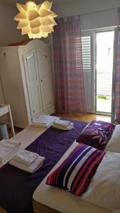 Postel nebo postele na pokoji v ubytování Apartments Veronika