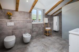 a bathroom with a toilet and a sink at Otium in Kaštela +43 photos