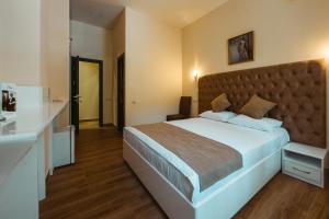 Ένα ή περισσότερα κρεβάτια σε δωμάτιο στο L'image Art Hotel