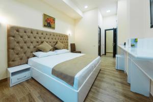 Ένα ή περισσότερα κρεβάτια σε δωμάτιο στο L'image Art Hotel