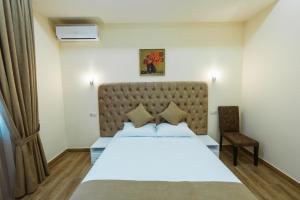 Ένα ή περισσότερα κρεβάτια σε δωμάτιο στο L'image Art Hotel