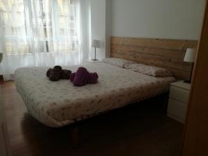 Łóżko lub łóżka w pokoju w obiekcie Marina La Concha