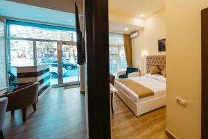 Ένα ή περισσότερα κρεβάτια σε δωμάτιο στο L'image Art Hotel