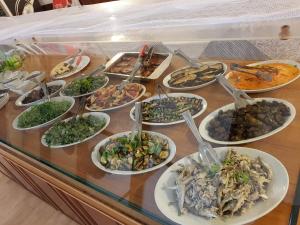 a buffet of different types of food on a table at Locanda Aria del Re in Sapri