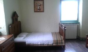 Postel nebo postele na pokoji v ubytování Kuca Roza