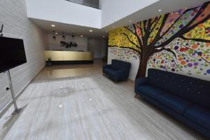 TV a/nebo společenská místnost v ubytování Vivid A Boutique Hotel