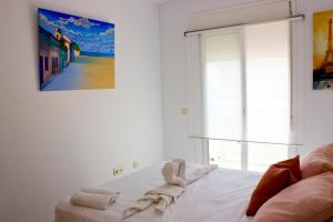 Łóżko lub łóżka w pokoju w obiekcie Seaview Fuengirola Apartment