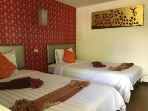 Krevet ili kreveti u jedinici u okviru objekta Paradise Resort Phi Phi