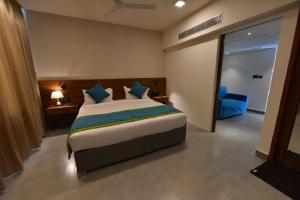 A bed or beds in a room at Vivid A Boutique Hotel