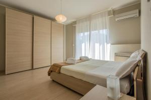 Posteľ alebo postele v izbe v ubytovaní Ca Silvia Lido di Venezia