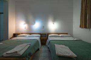 A bed or beds in a room at Irini